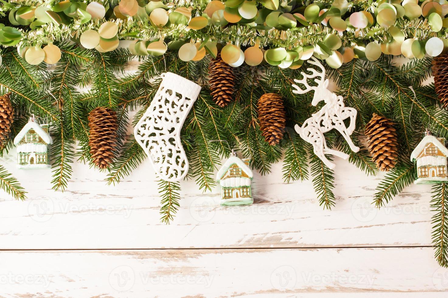 Christmas New Year's background with a large garland of decorations on a white wooden table. top view. photo