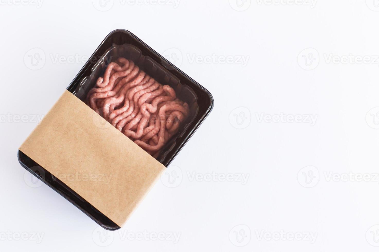 minced pork meat in vacuum plastic packaging on a white background. top view. logo layout design. photo