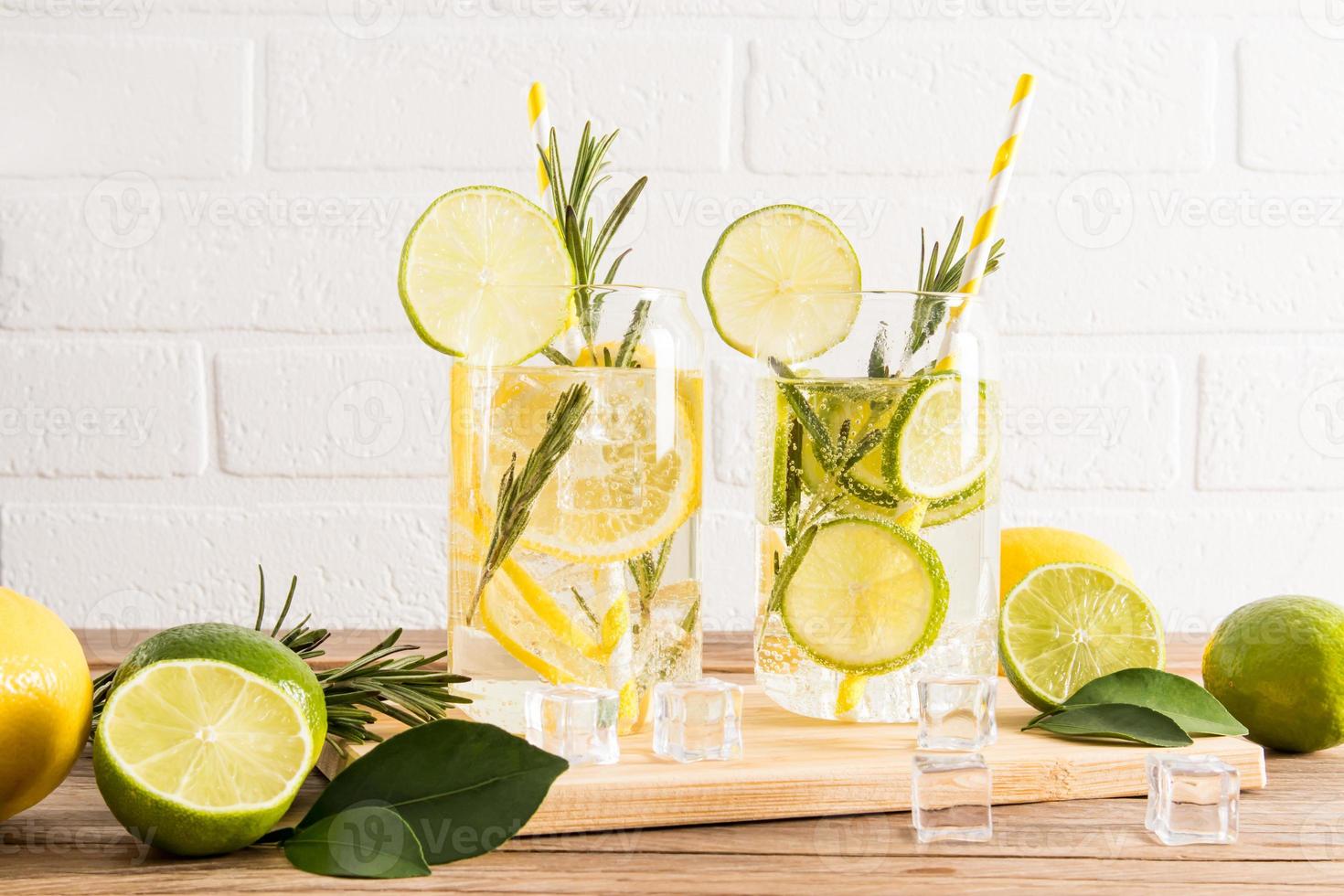 delicious healthy soft drinks with slices of lime and lemon, sprigs of
