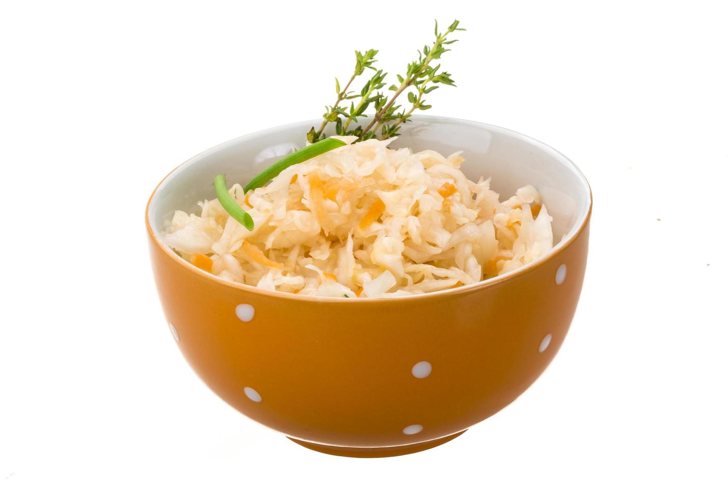 Fermented Cabbage in a bowl on white background photo