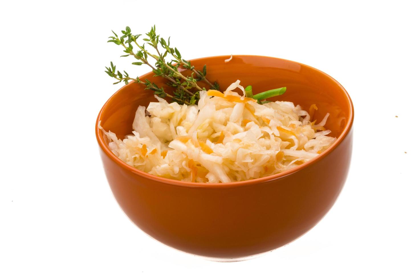 Fermented Cabbage in a bowl on white background photo
