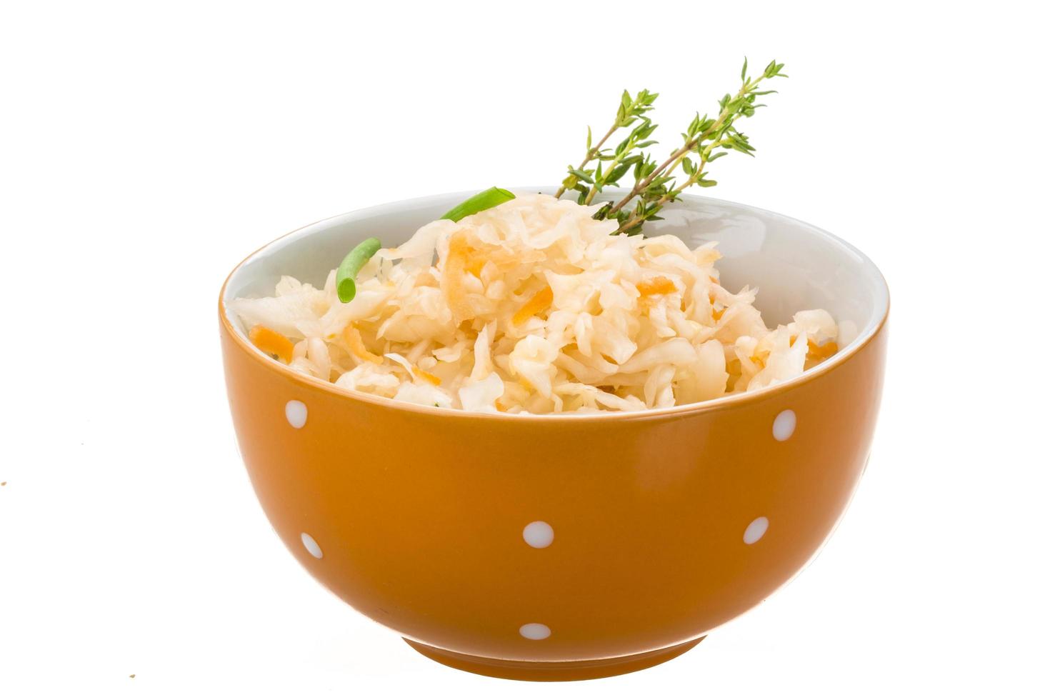 Fermented Cabbage in a bowl on white background photo