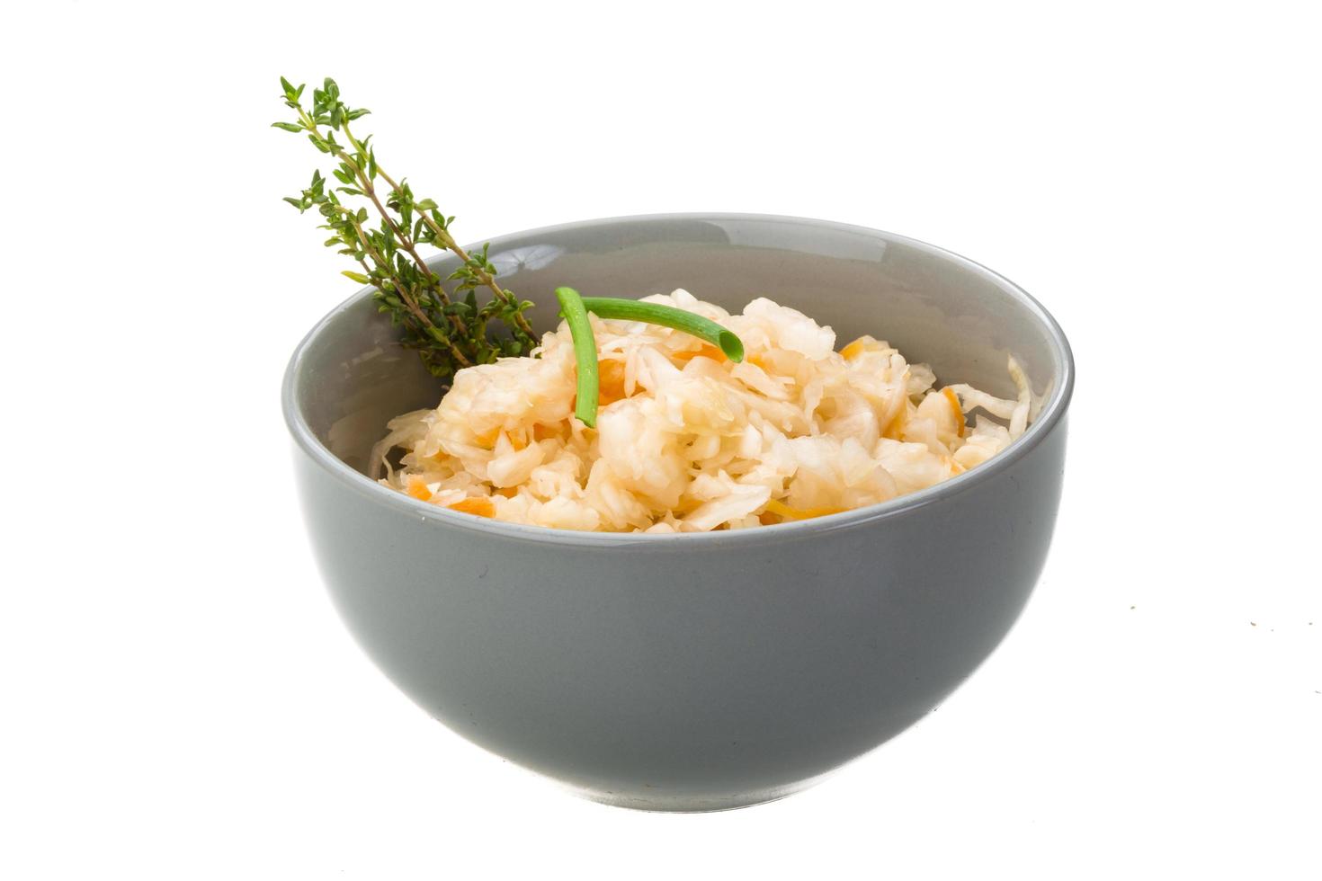 Fermented Cabbage in a bowl on white background photo