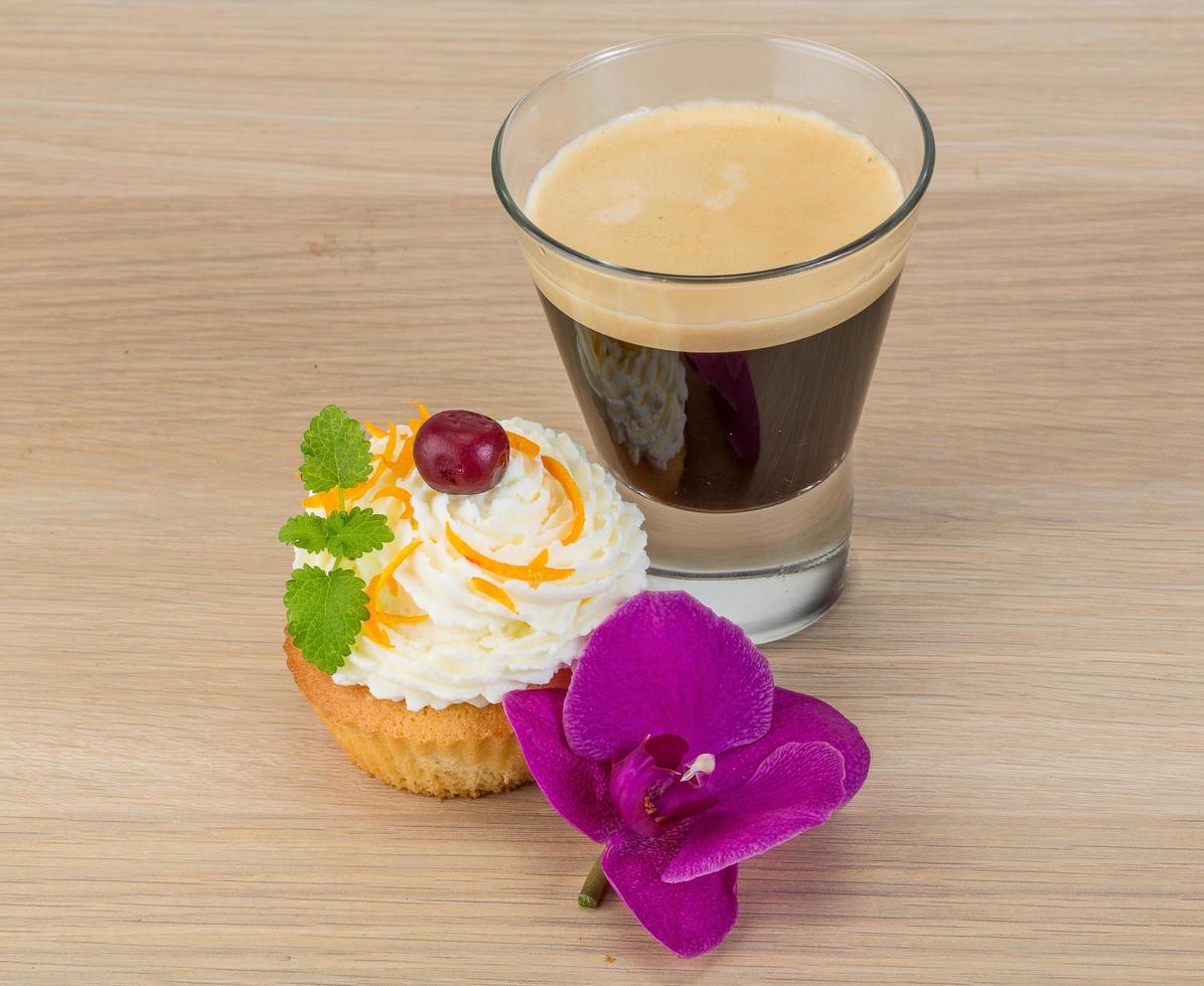 Cupcake on wooden background photo