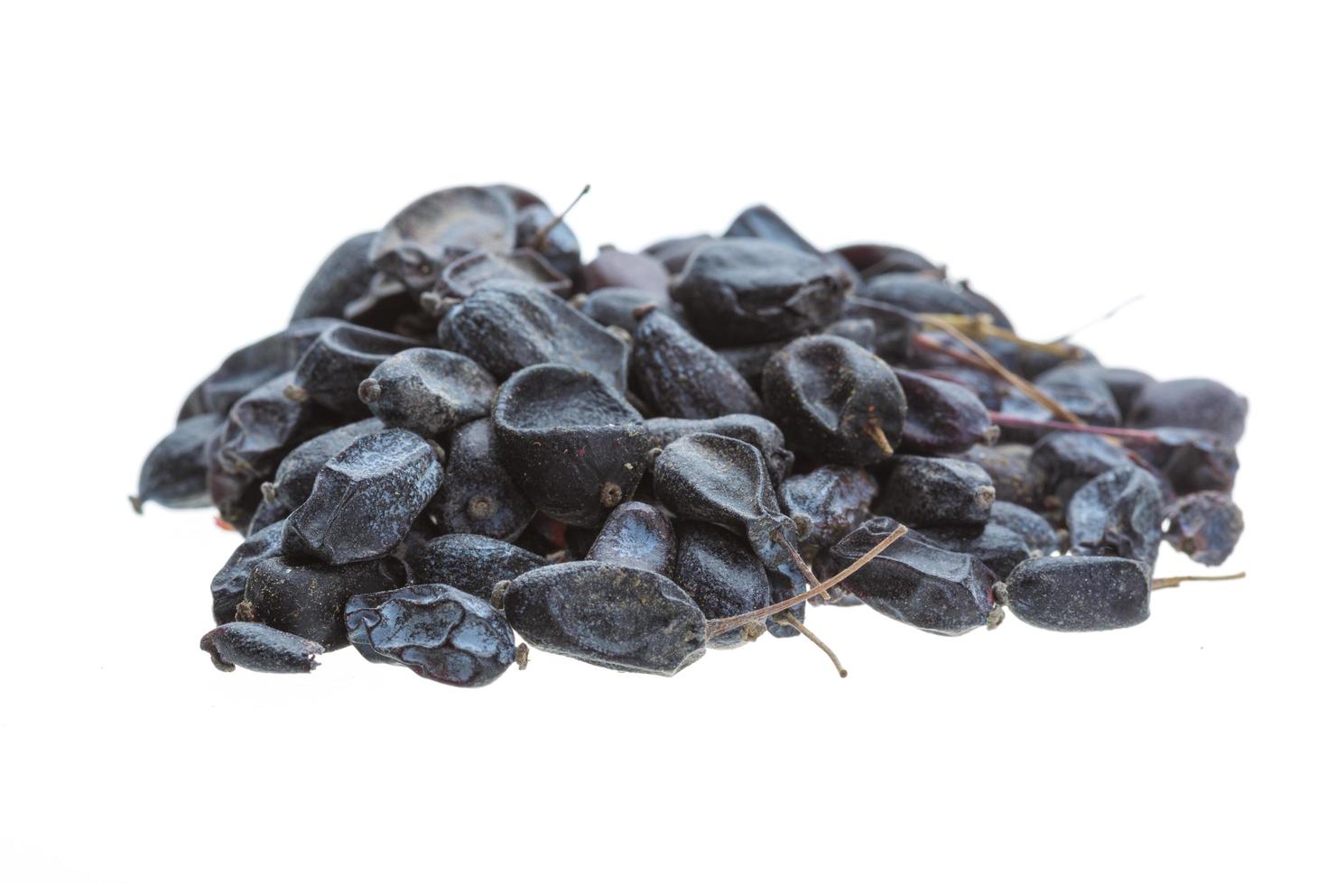 Dried barberries on white background photo