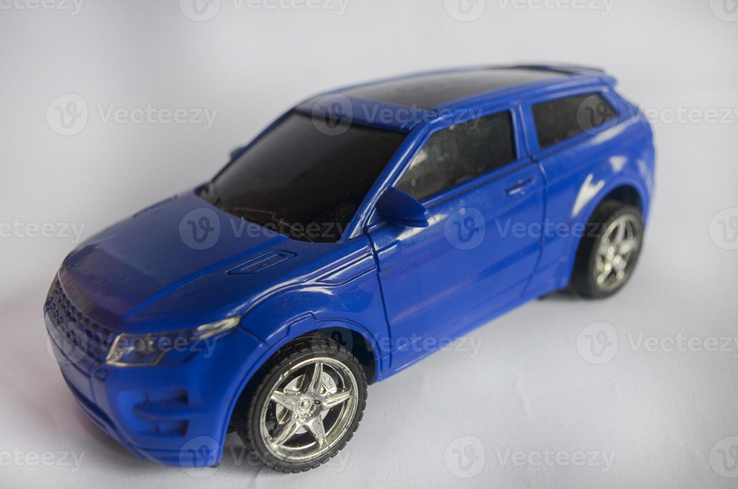 Soft focus Blue Car Miniature isolated on white background photo