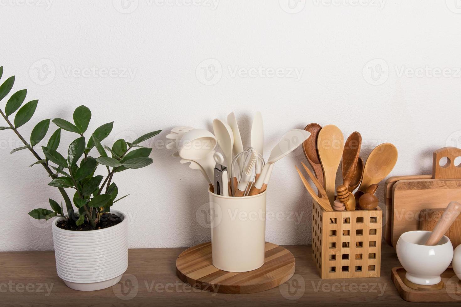 front view of a modern kitchen countertop with homemade cooking utensils made of eco materials. the concept of cooking healthy food. photo