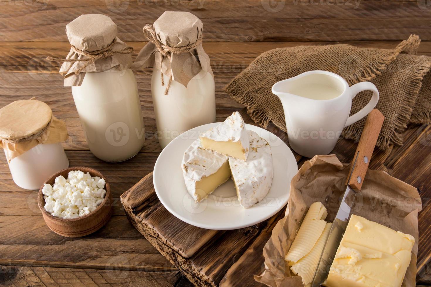 animal products, farmed dairy products on a wooden brown table. photo