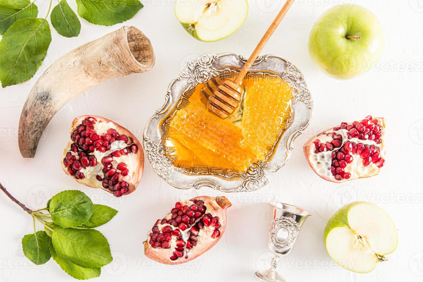 flat layout of traditional treats for New Year Rosh Hashanah. white background. top view. photo