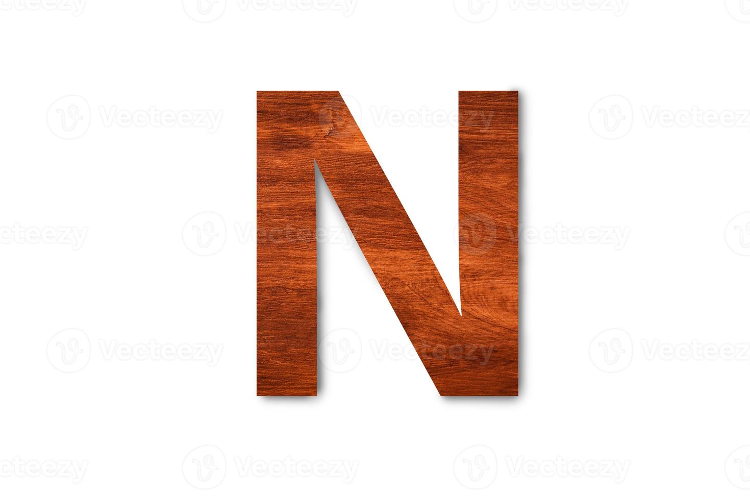 Modern wooden alphabet letter N isolated on white background with clipping path for design photo