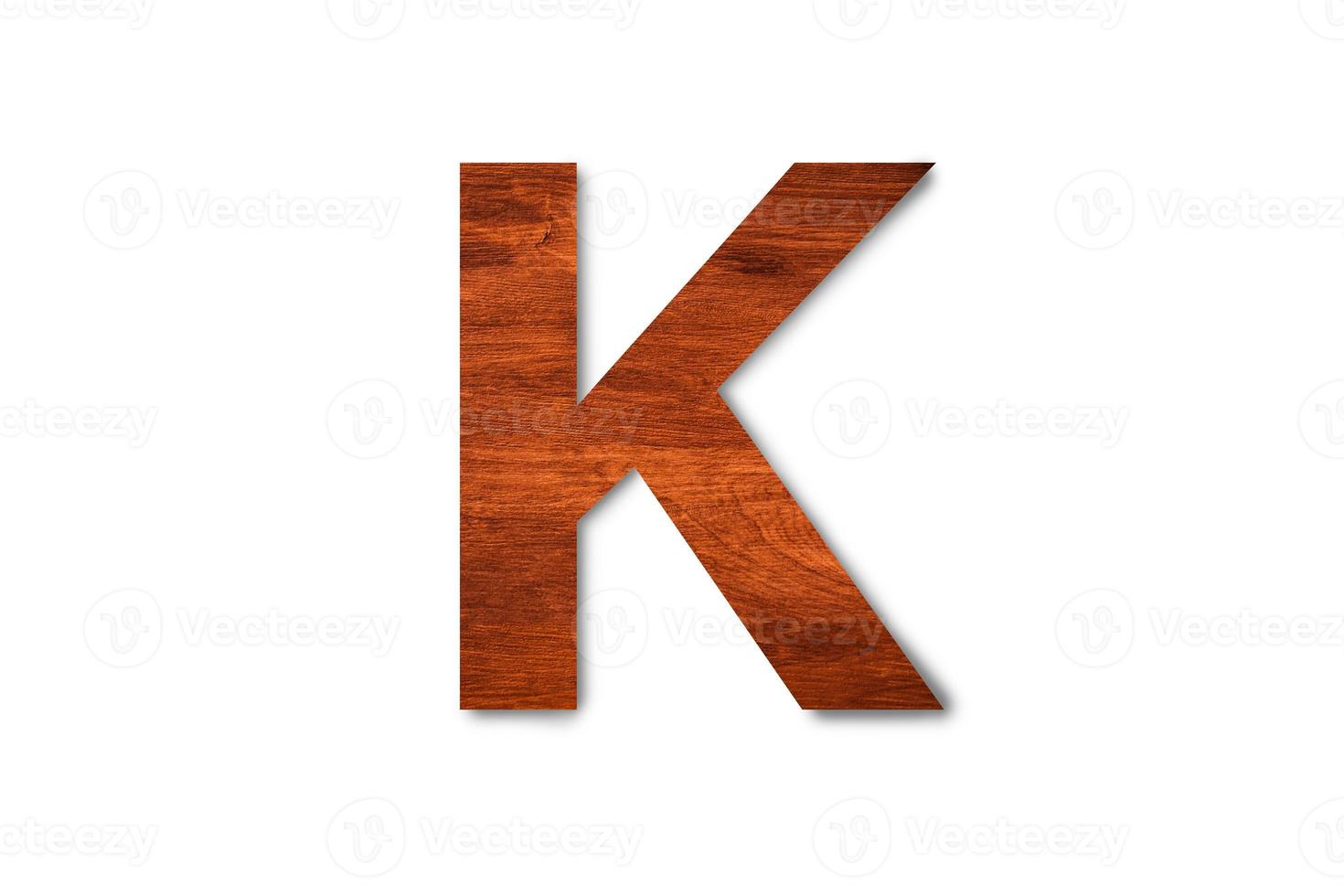 Modern wooden alphabet letter K isolated on white background with clipping path for design photo