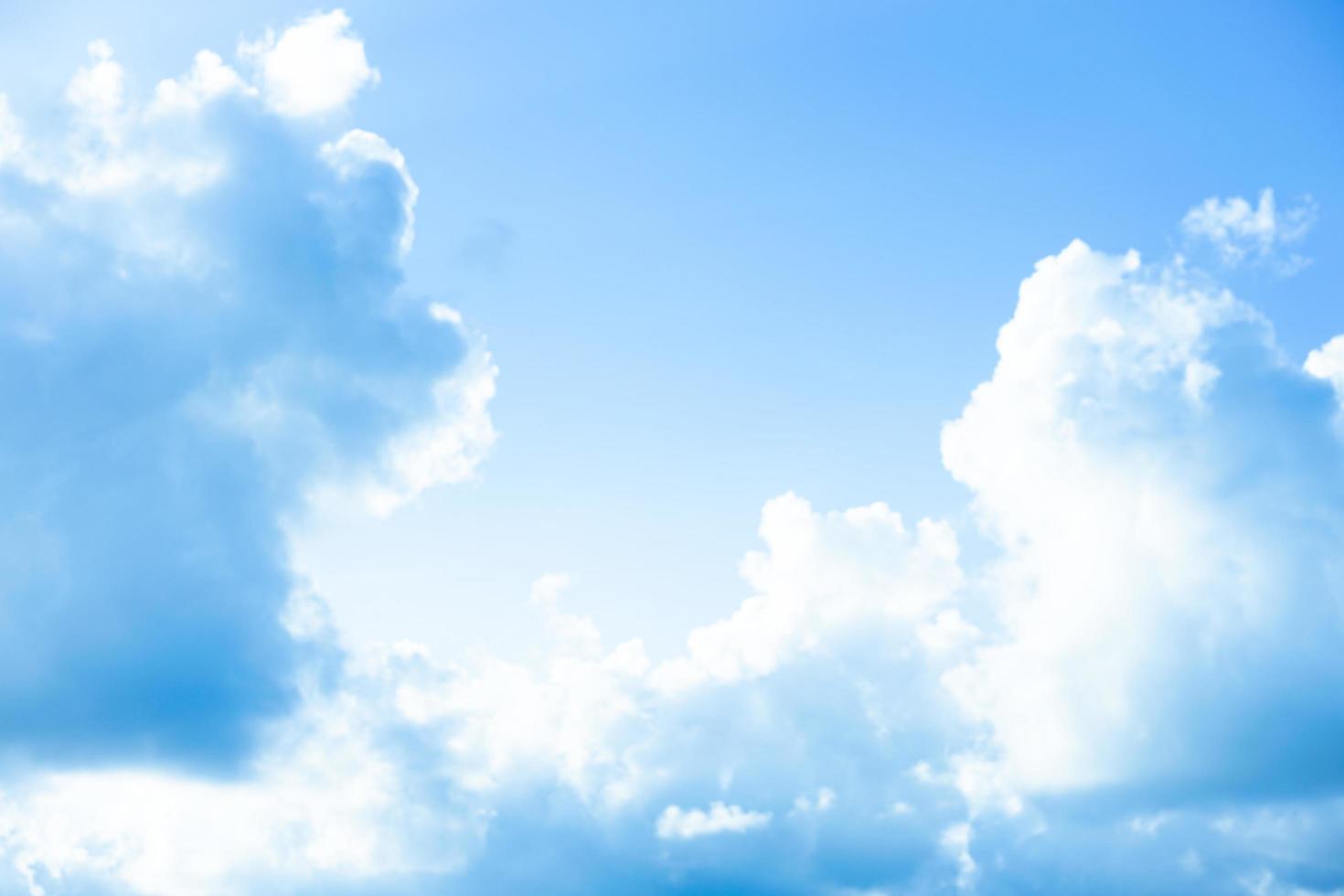 White clouds with blue sky Background On a bright day with copy space for text or banner for website photo