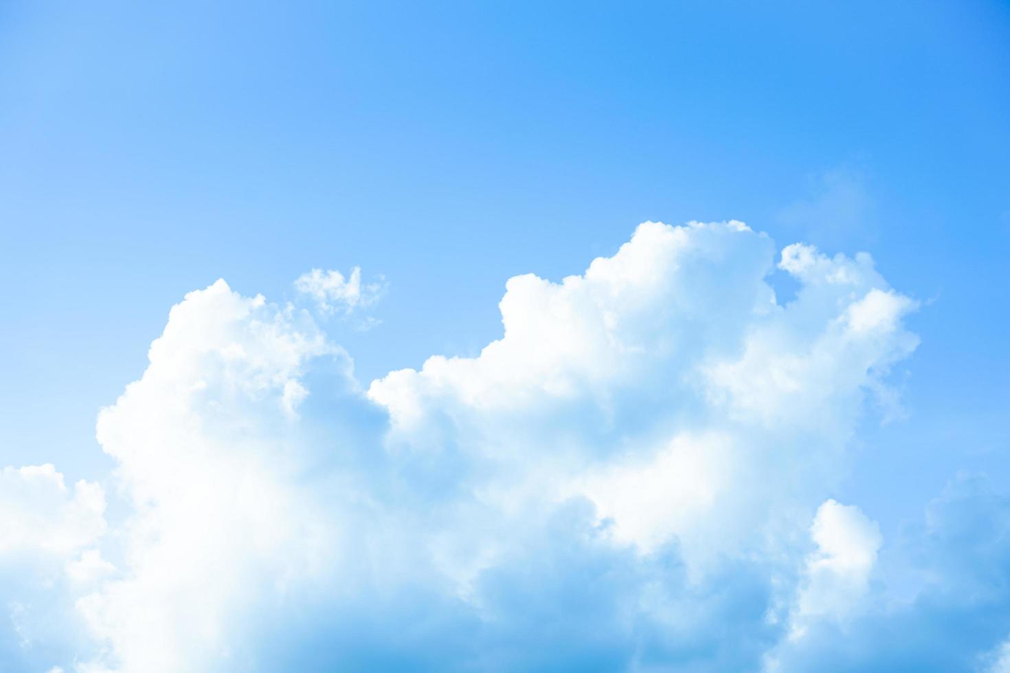 White clouds with blue sky Background On a bright day with copy space for text or banner for website photo