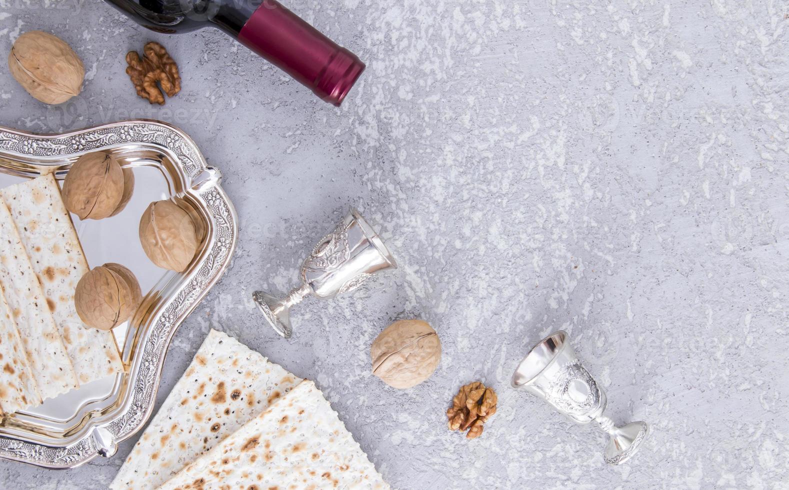 festive background of the Jewish Passover with traditional treats. top view. a copy of the space. gray concrete background. photo