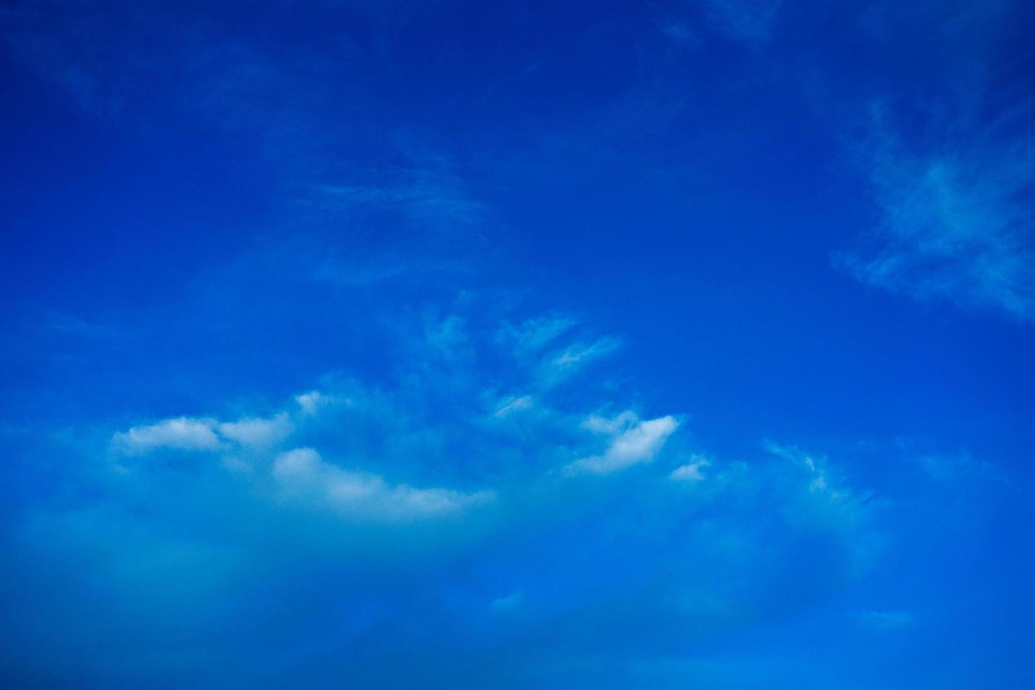 Wallpaper of White clouds on blue sky with copy space for banner background photo