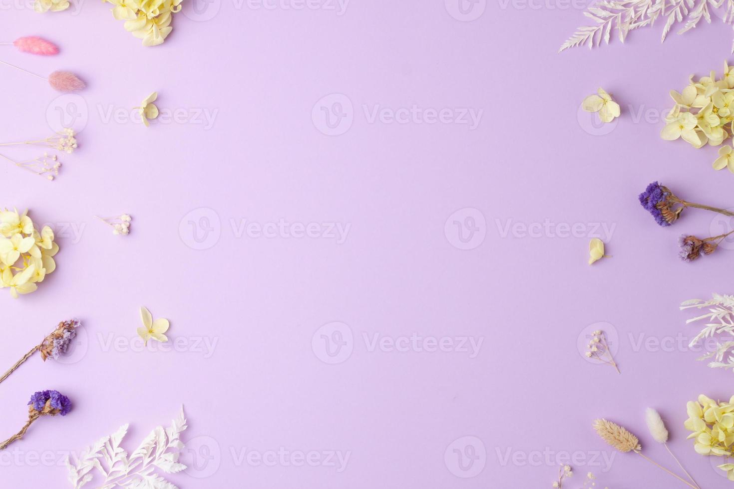 Cosmetic background with flowers on rose. Flat lay, copy space photo