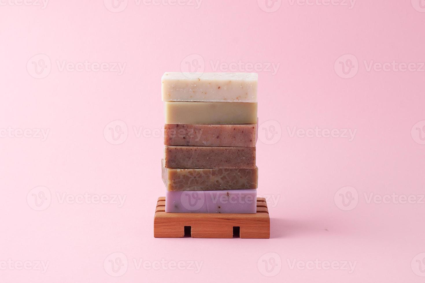 Soap on pink background. Close up, copy space photo