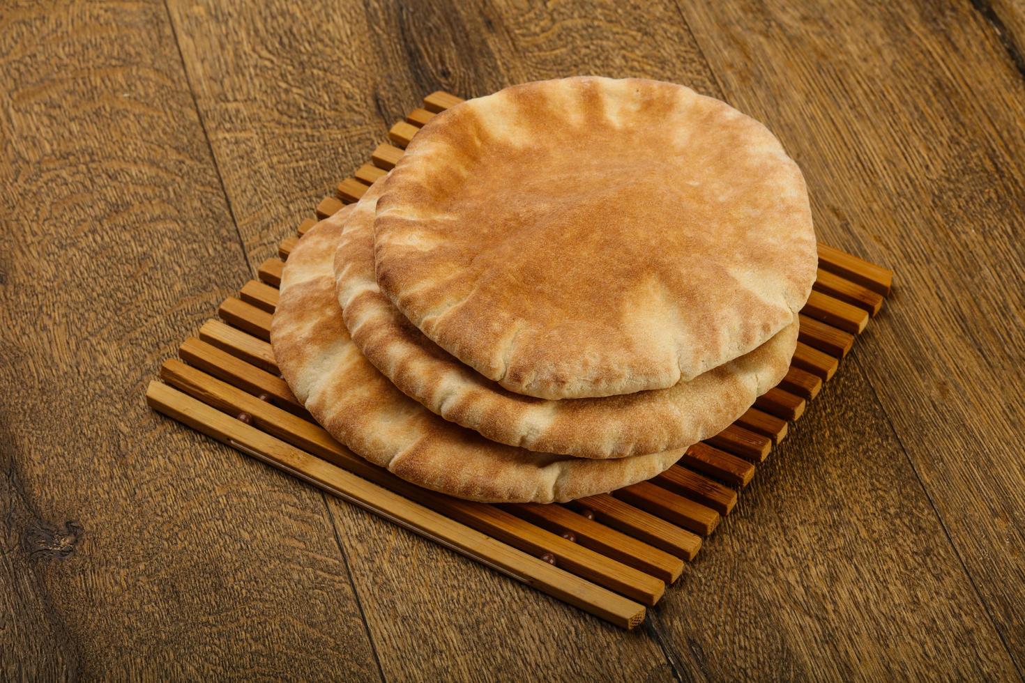 Pita bread on wood photo