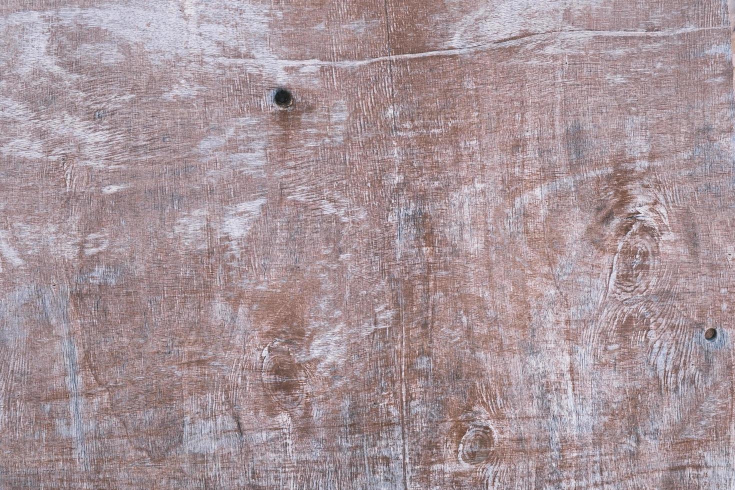 Old painted wood brown wall texture, textured wooden reddish surface background, dark dry stained board, grunge weathered panel, retro-styled obsolete wood, vintage and rustic, copy space. photo