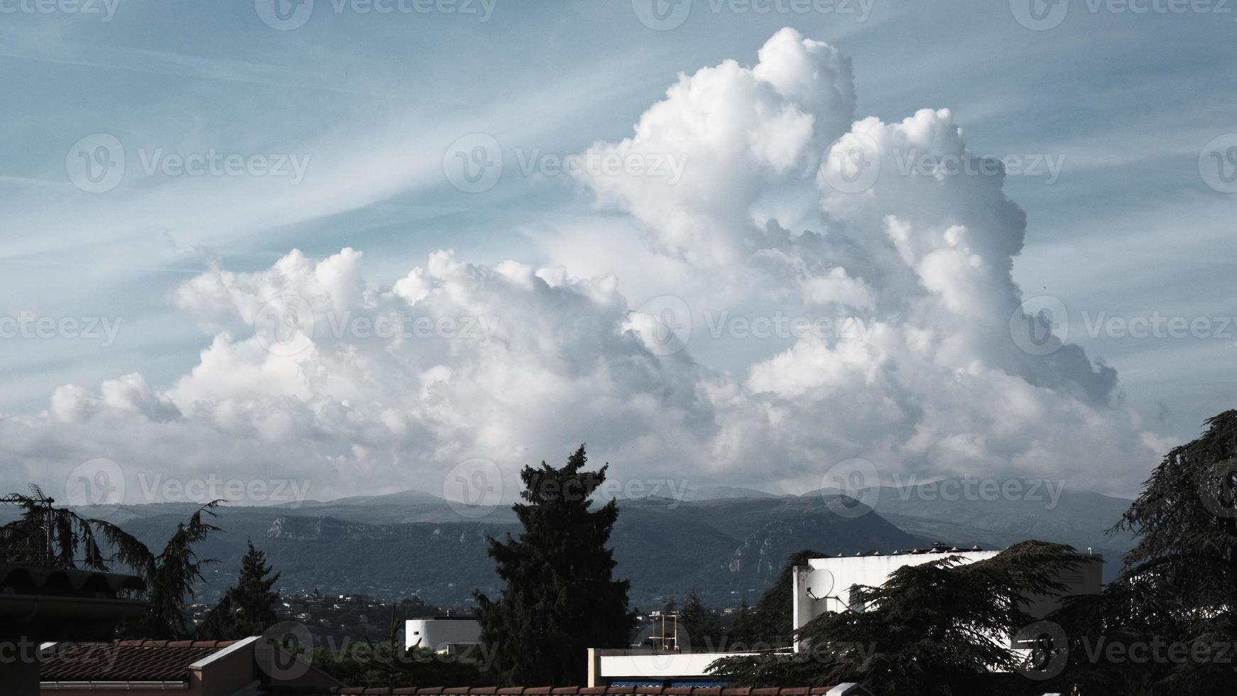 High cumulus clouds over the mountains, panorama, landscape, beautiful sky with cloud, heaven on the summer day, dramatic cloudscape, peaceful environment, skyscape over the mountain. photo