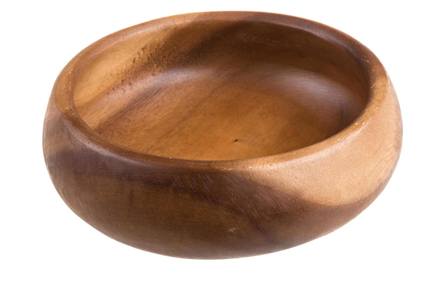 Wooden bowl on white photo