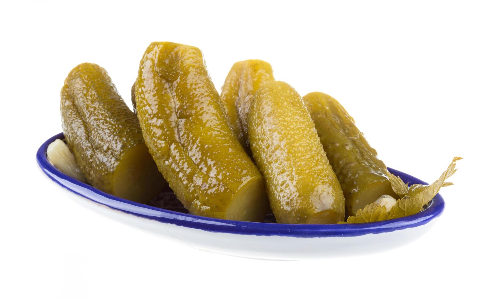 Marinaded cucumber on white photo