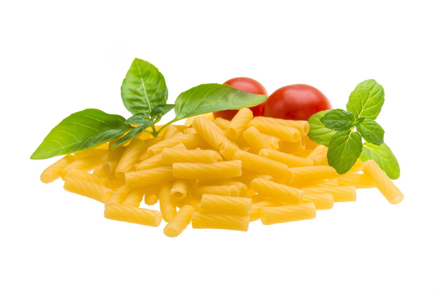 Raw macaroni on white background photo