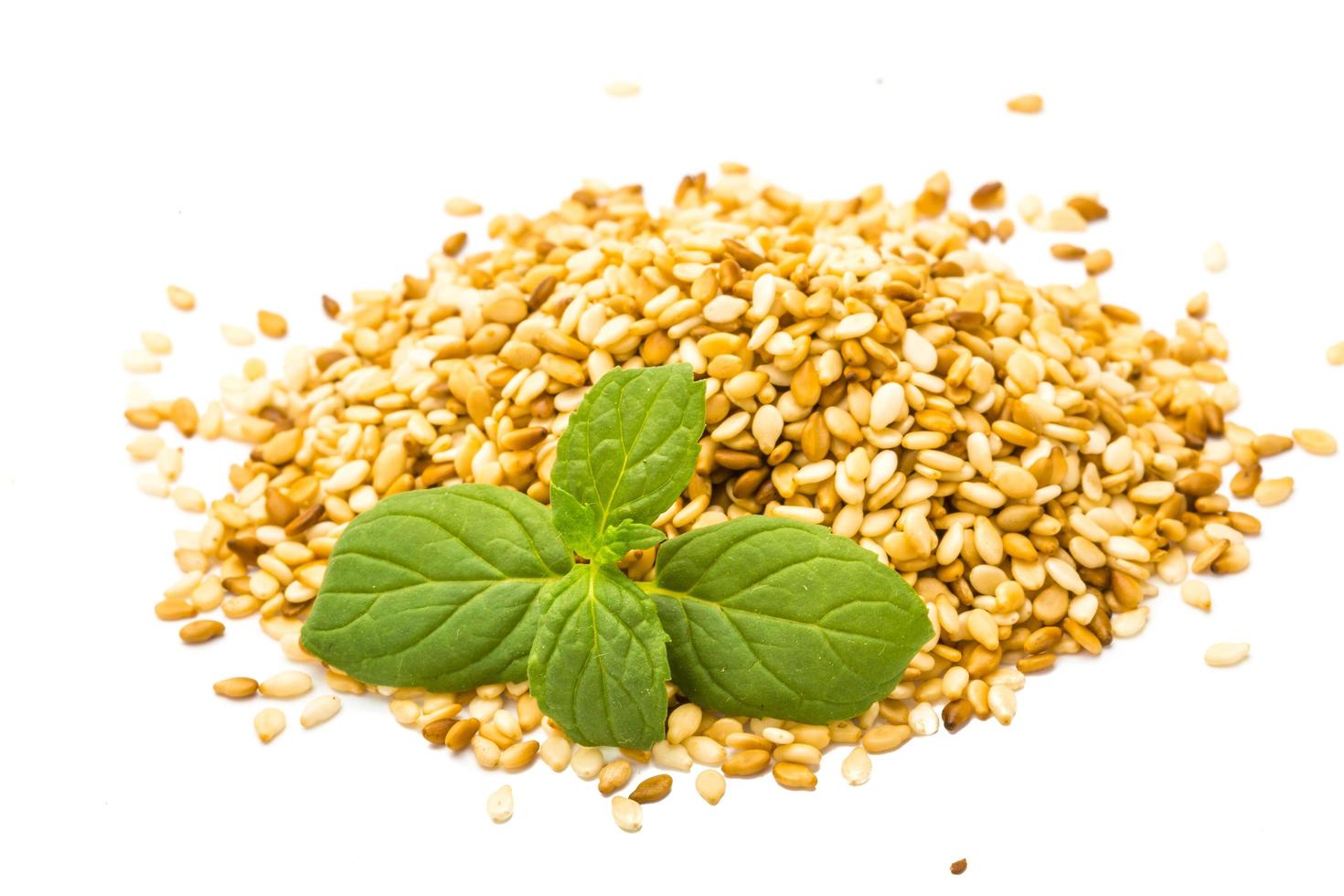 Sesame seeds on white background photo