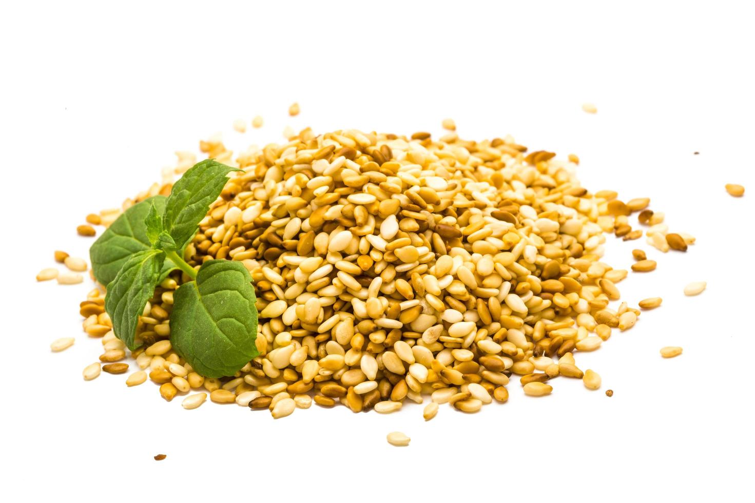 Sesame seeds on white photo