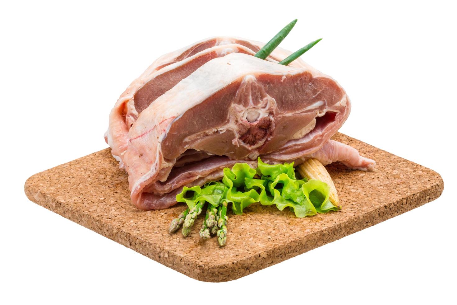 Raw lamb on white photo