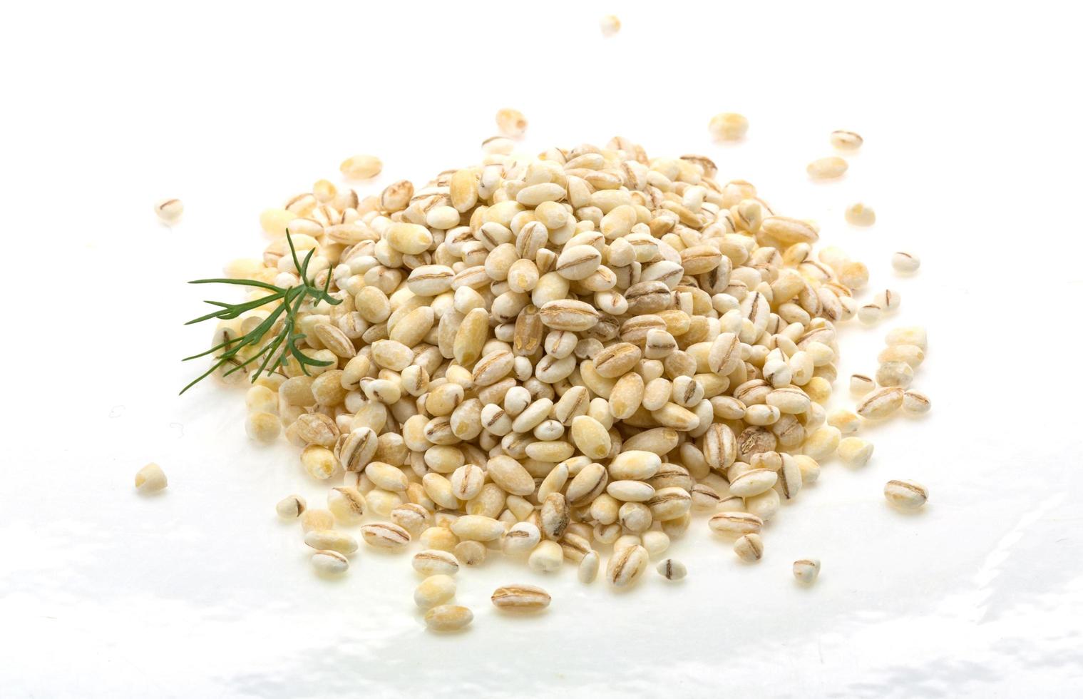 Pearl barley on white photo