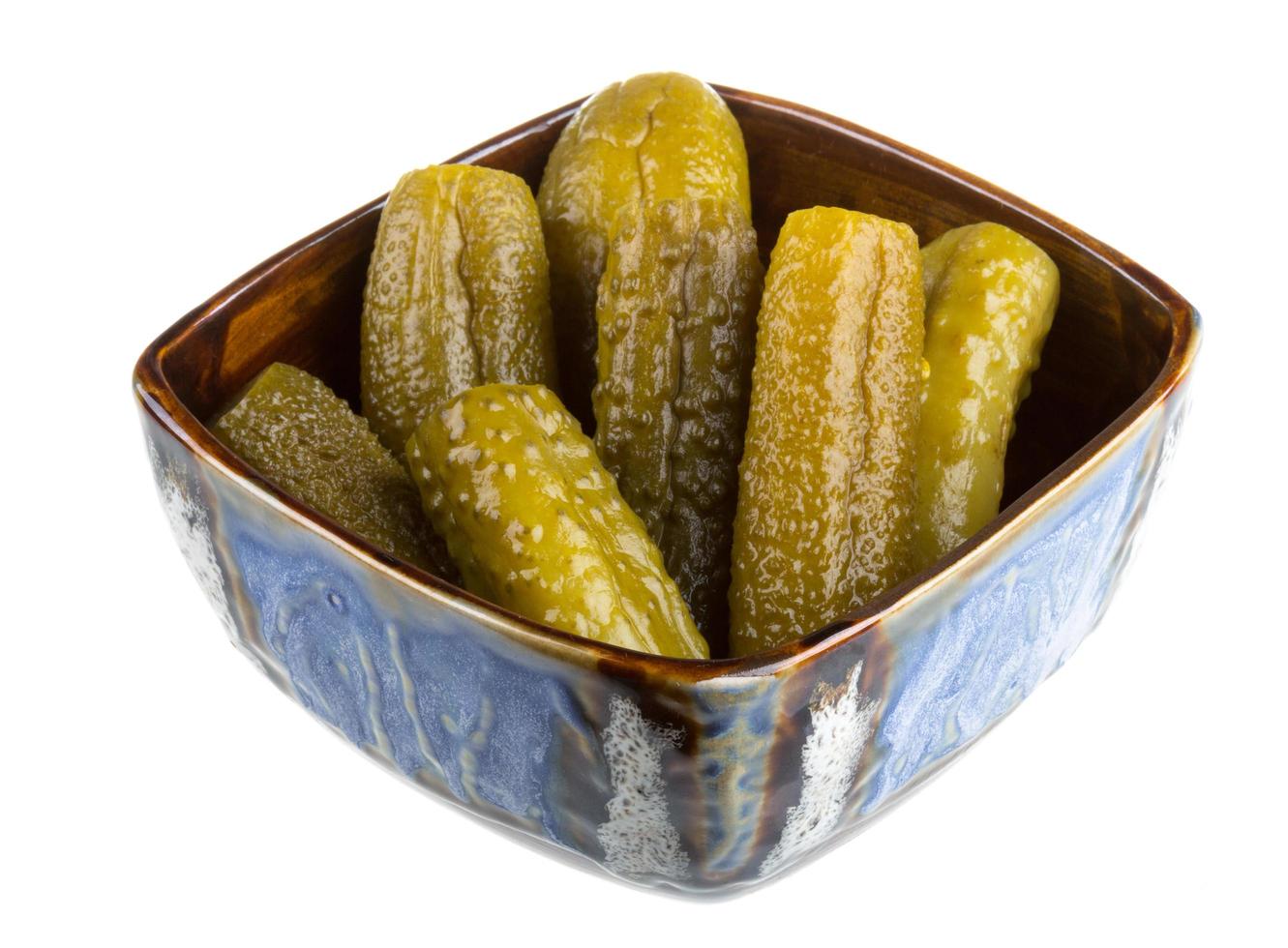 Marinaded cucumber on white photo