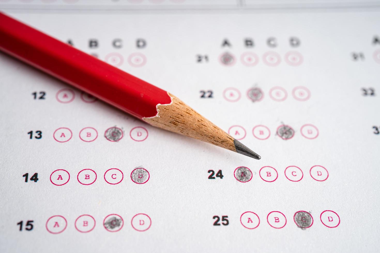 Answer sheets with pencil drawing fill to select choice, education concept. photo