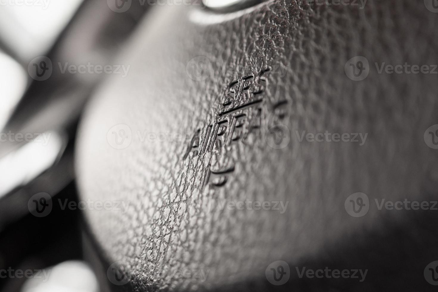 Safety airbag sign on car steering wheel with horn icon photo