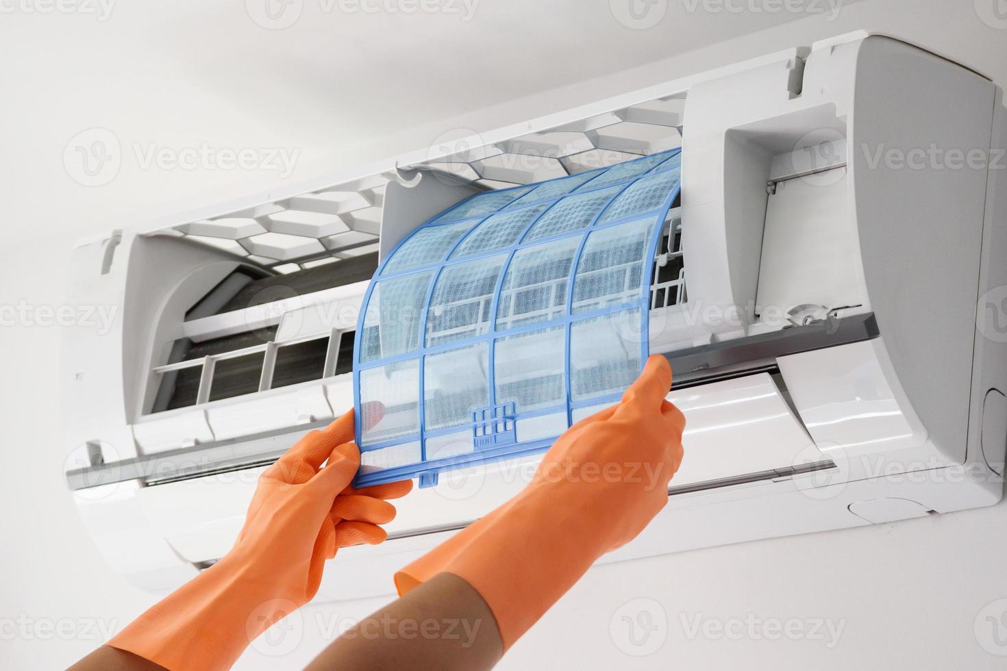 Asian man hand hold air conditioner filter cleaning concept photo