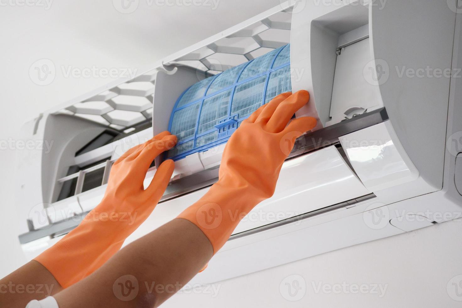 Asian man hand hold air conditioner filter cleaning concept photo