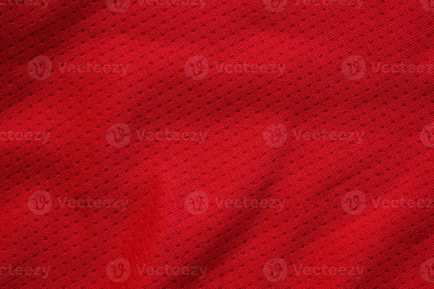 Red sports clothing fabric football shirt jersey texture close up photo