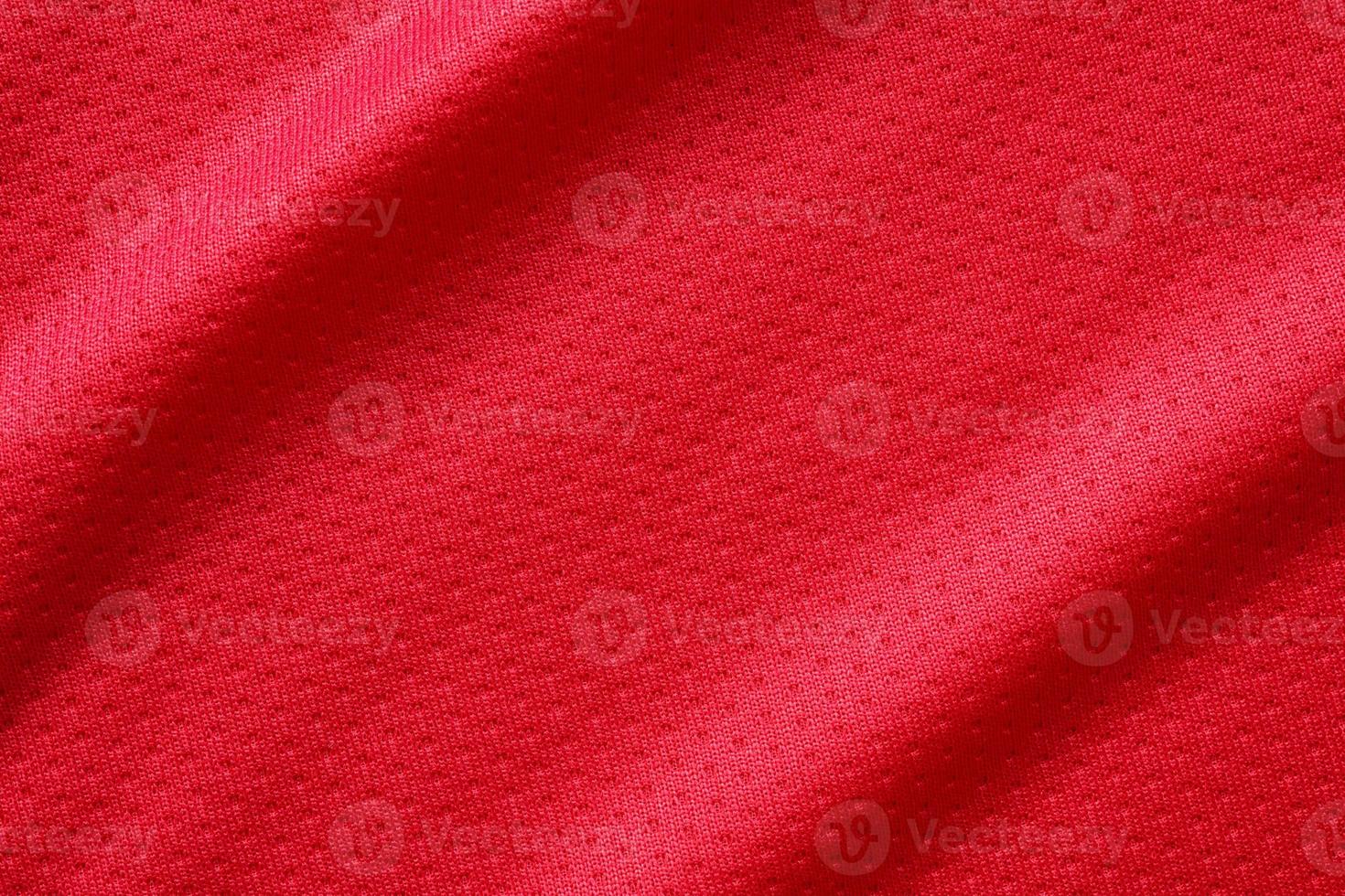 Red sports clothing fabric football shirt jersey texture close up photo