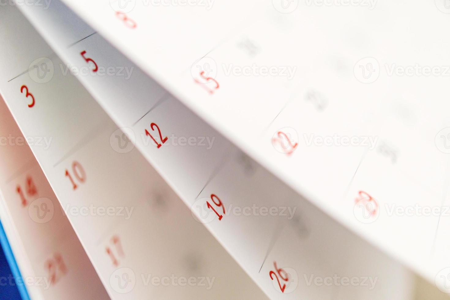 Calendar page flipping sheet close up on office table background business schedule planning appointment meeting concept photo