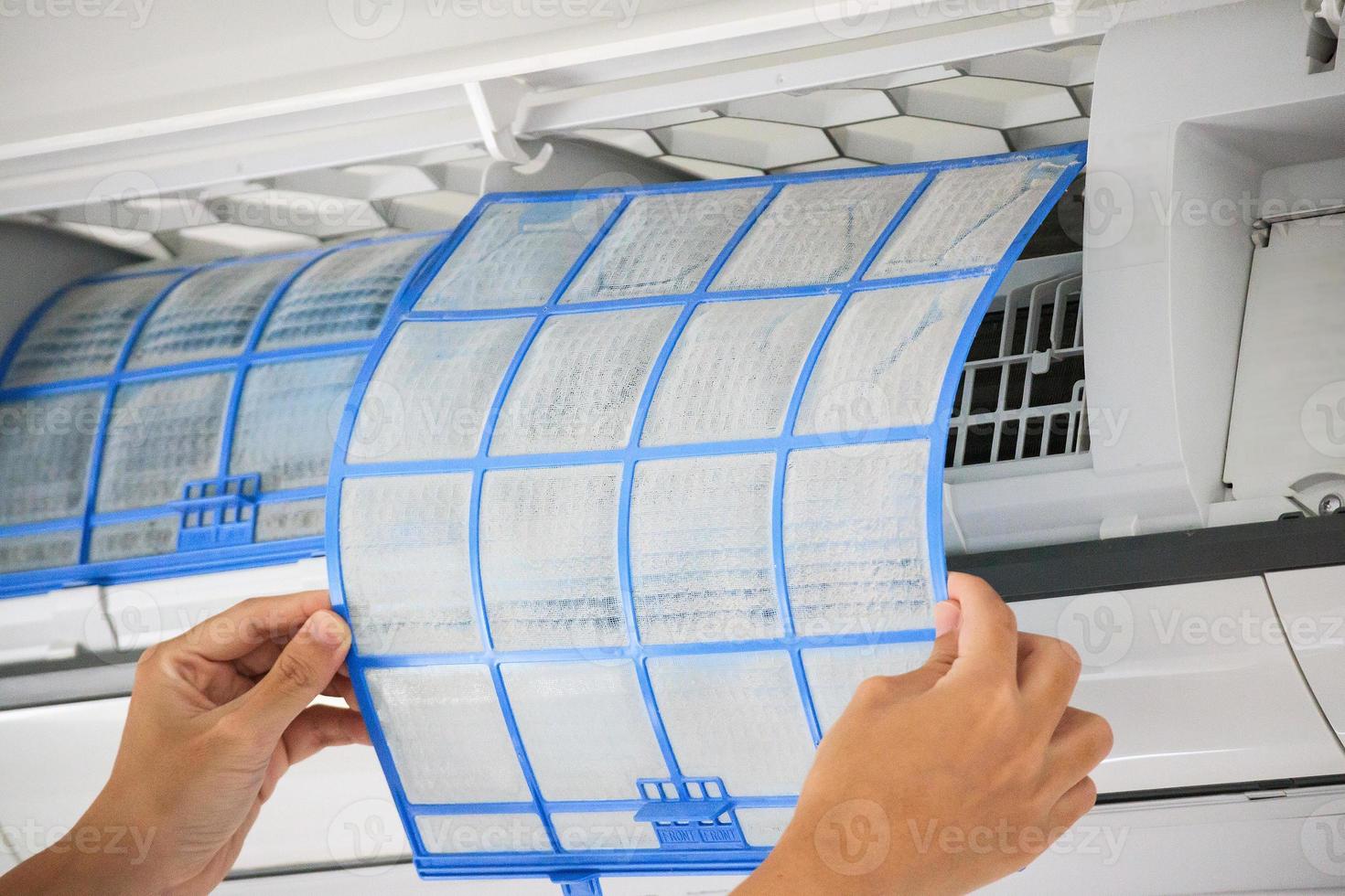 man hand hold air conditioner filter cleaning concept photo