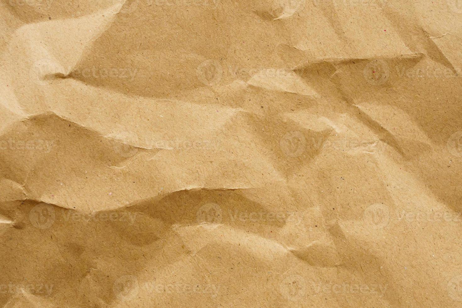 Fondo de textura de hoja de kraft reciclado de papel arrugado marrón foto