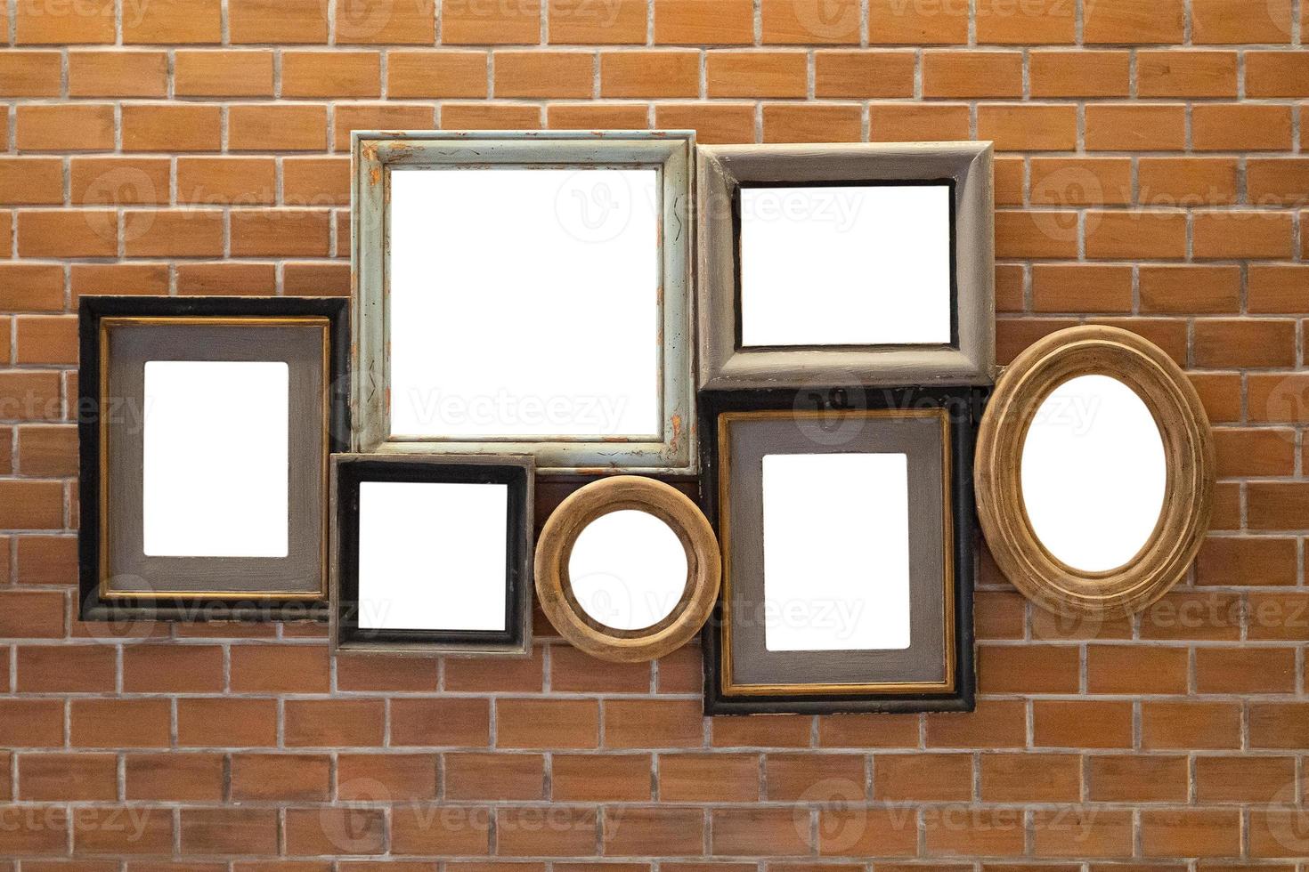 Blank vintage wooden picture photo frame set collection on brick wall background