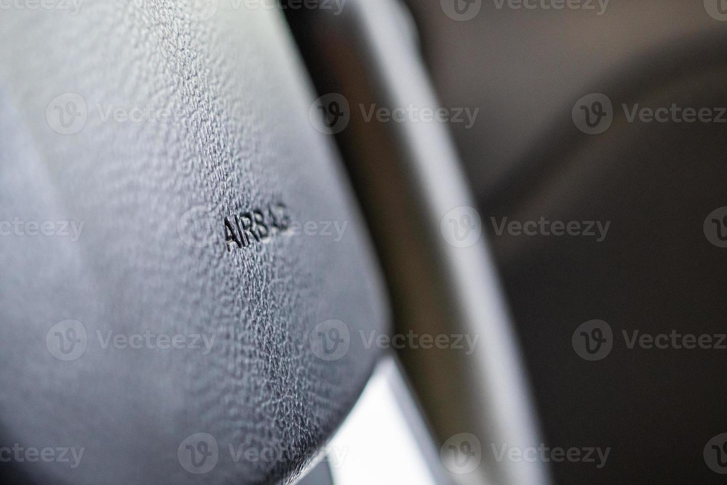 Safety airbag sign on car steering wheel photo