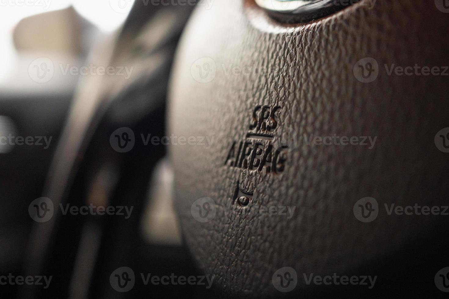 Safety airbag sign on car steering wheel with horn icon photo