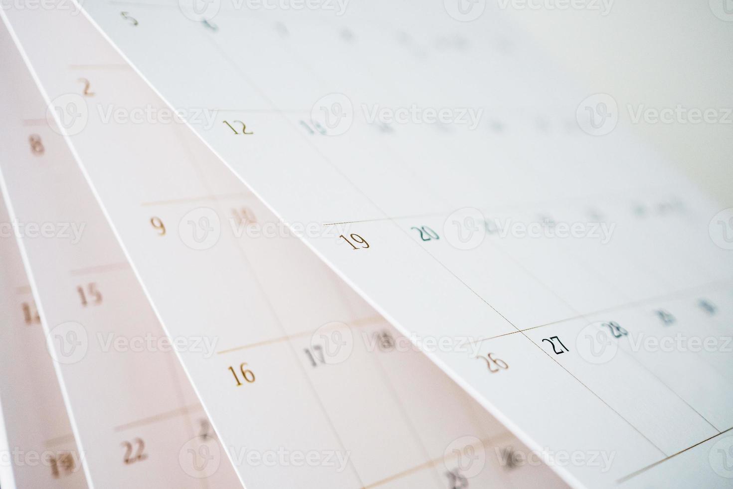 Calendar page flipping sheet close up blur background business schedule planning appointment meeting concept photo