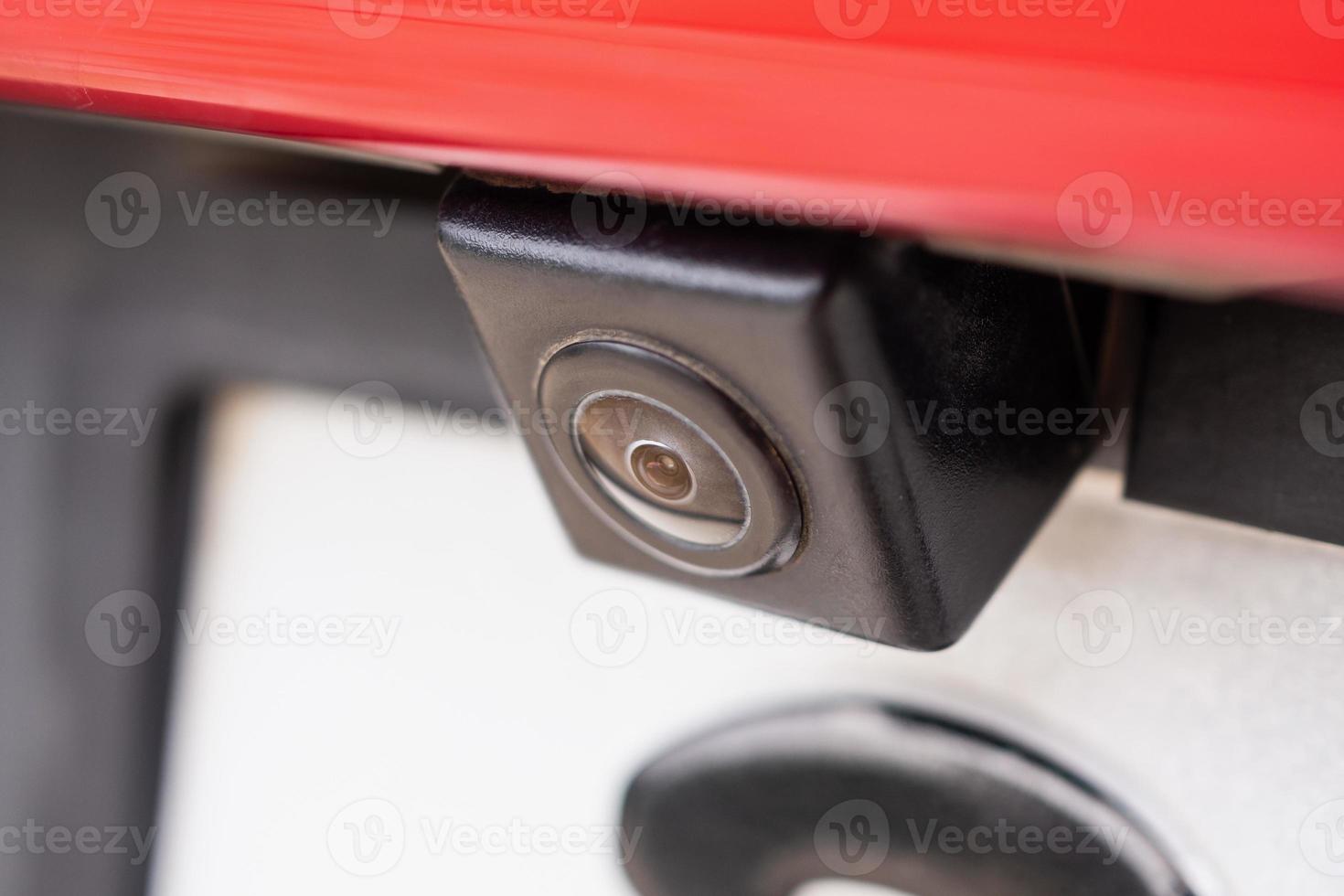 Red car rear view camera close up for parking assistance photo