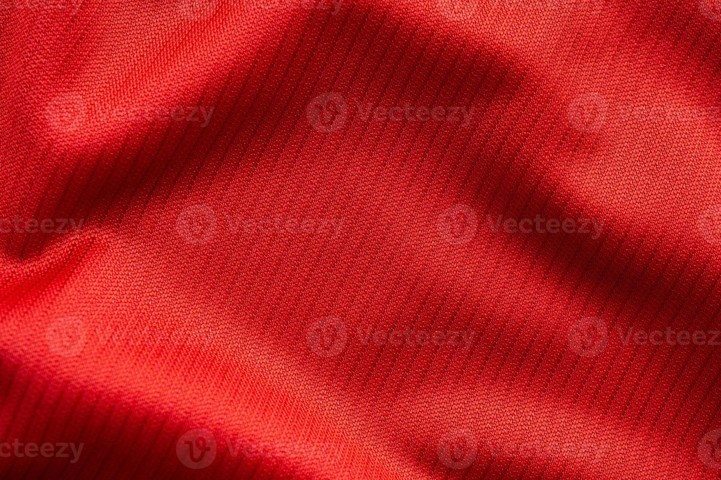 Red sports clothing fabric football jersey texture close up photo