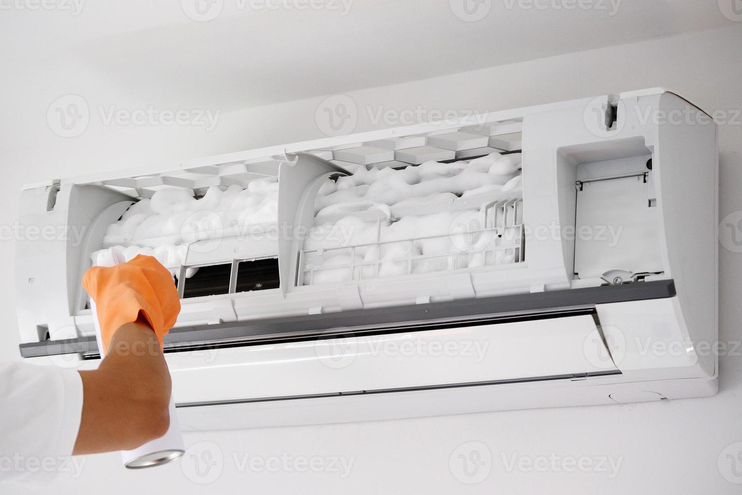 air conditioner cleaning with spray foam cleaner photo