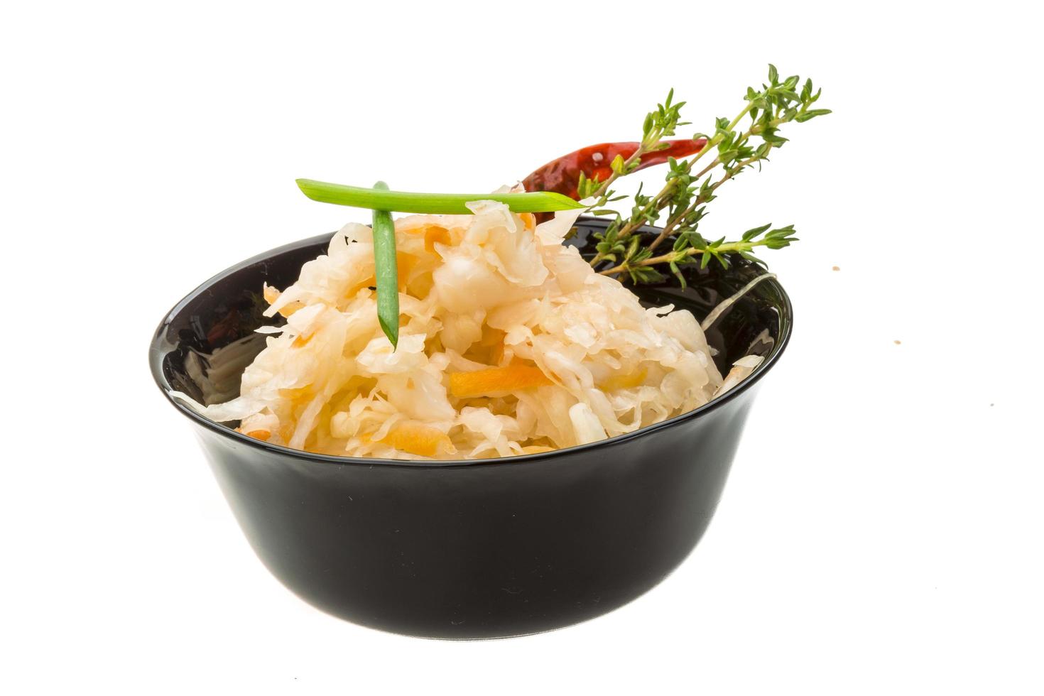 Fermented cabbage on white photo