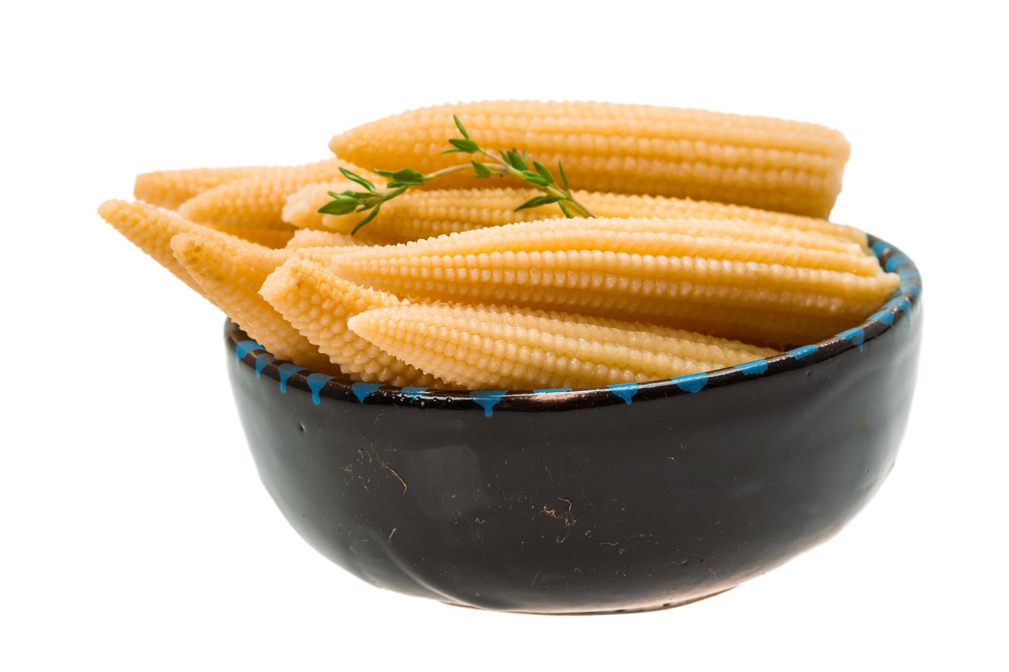 Baby corn on white photo